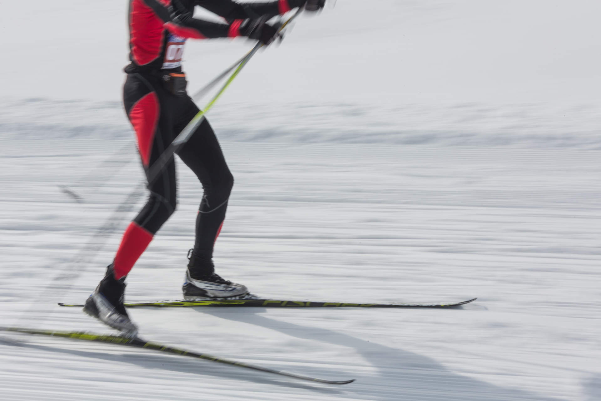 ALMATY, KAZAKHSTAN - FEBRUARY 18, 2017: amateur competitions in the discipline of cross-country skiing, under the name of ARBA Ski Fest. A man cross-country skiing on the trail in Almaty mount.